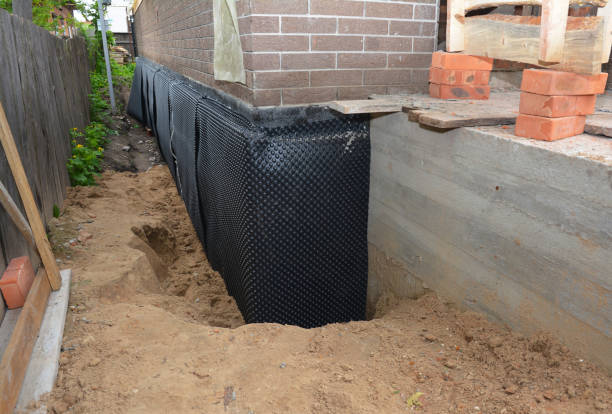 Happy homeowners after waterproofing job in Chatham